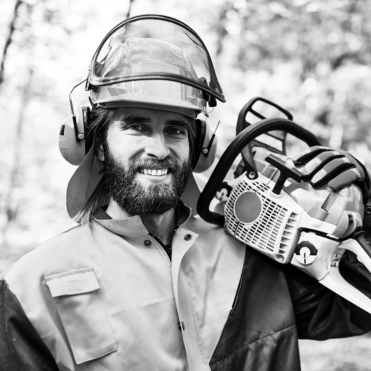 Lumberjack,Or,Forest,Worker,With,Chainsaw,And,Protective,Gear,In